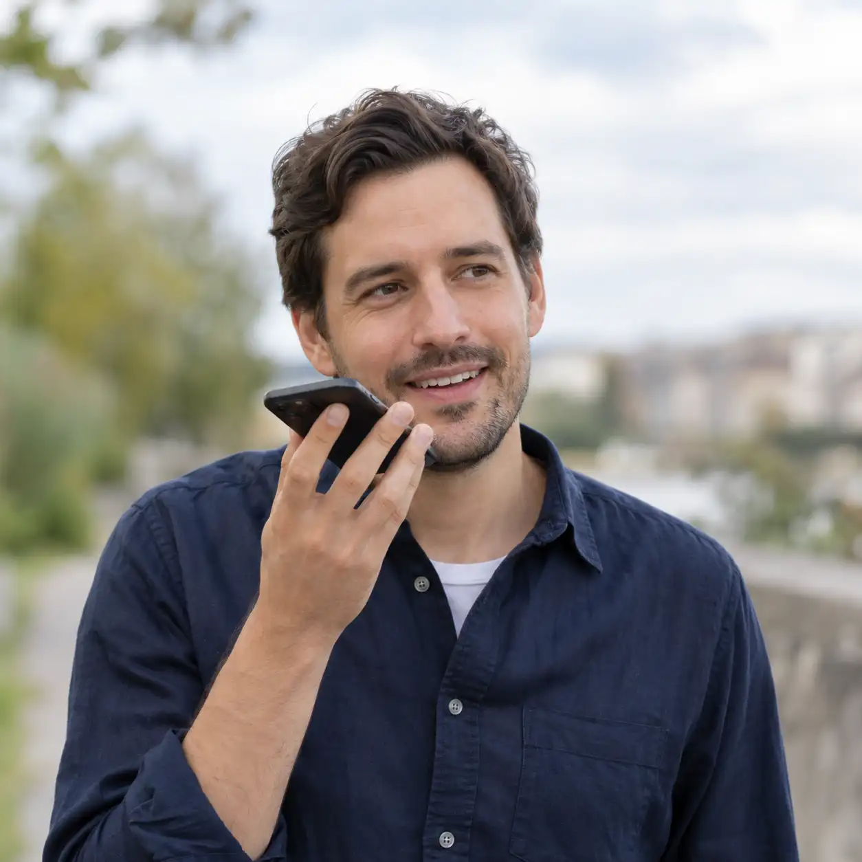 Man speaking into his smartphone